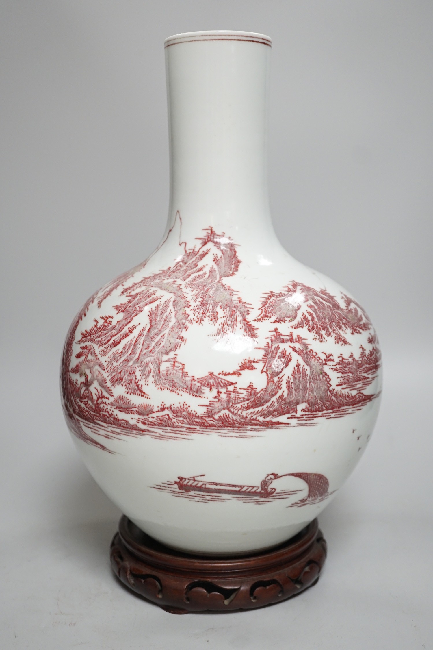 A large Chinese underglaze copper read landscape vase on hardwood stand, 40cm total